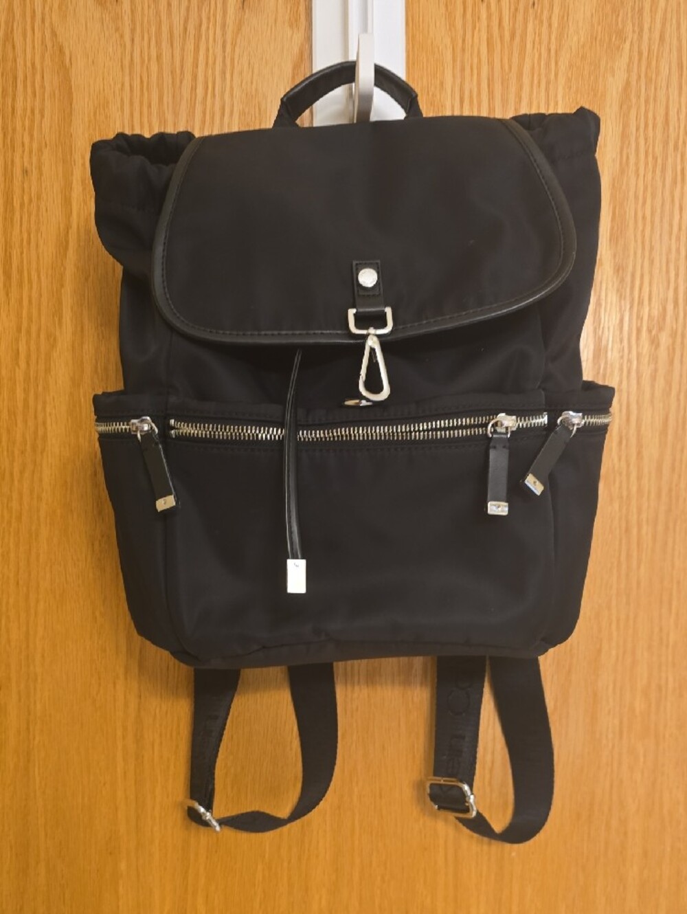 Unisex Calvin Klein Black Sleek Nylon Backpack with Branded Webbing.